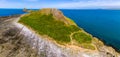 Panoramic aerial view of Worm`s Head and the Welsh coastline at low tide Rhossili