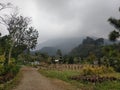 Panoramic afternoon in the countryside which is located under the mountain, implying comfort and shade Royalty Free Stock Photo