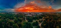 Panoramic air view of colorful hot air ballons prepare for an early morning takeoff from park in small european city Royalty Free Stock Photo