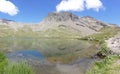 Panoramic: the alpine mountain reflected in the water of the lake