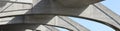 Panoramic architectural background with modern concrete bridge arches. Horizontal urban composition Royalty Free Stock Photo