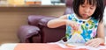 Asian girl home schooling sewing Royalty Free Stock Photo