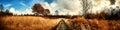 Panoramic autumn landscape with country path Royalty Free Stock Photo