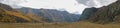 Panoramic autumn view of the Altai mountains and grazing horses. Chuysky tract, Altai Republic, Russia