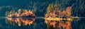 Panoramic autumn view of Eibsee lake. Unbelievable morning scene with first sunlight glowing small islands on bottom of the Royalty Free Stock Photo
