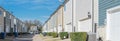 Panoramic back alley of residential neighborhood line of two-car garage door colorful houses near Dallas Royalty Free Stock Photo