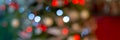 Panoramic banner of blurred green and red bokeh holiday lights at night christmas tree background Royalty Free Stock Photo