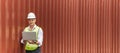 Panoramic banner. caucasian white engineer control worker working on digital laptop computer with cargo container in background at Royalty Free Stock Photo