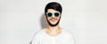 Panoramic banner view, portrait of young smiling man wearing cyan shades on background of white color. Royalty Free Stock Photo