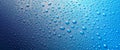 Panoramic banner of water drops on blue metal