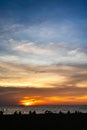 Panoramic beautiful colorful golden hour twilight sky. silhouettes, people meet sunset in tropics, Thailand, Pattaya. Beautiful Royalty Free Stock Photo