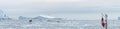 panoramic beautiful icebergs with fishing boat in Geenland from a boat trip from Ilulissat