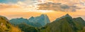 Panoramic beautiful scenic mountain range with blue sky, cloud and blast horizon sun Royalty Free Stock Photo