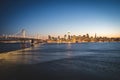 Panoramic beautiful scenic view of the Oakland Bay Bridge and the San Francisco city in the evening, California Royalty Free Stock Photo