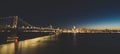 Panoramic beautiful scenic view of the Oakland Bay Bridge and the San Francisco city in the evening, California Royalty Free Stock Photo