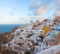 Panoramic beautiful view of Oia town on Santorini island, Cyclades, Greece. Traditional famous white houses, windmills and Royalty Free Stock Photo