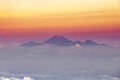Panoramic beautiful view on theRinjani volcano, Lombok, from top og the volcano Agung. Gradient purple pink yellow hazy horizon at