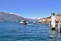 Beautiful panoramic view to ferry boat moving on the lake Como at Bellagio in early spring sunny day. Royalty Free Stock Photo