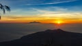 Panoramic beautiful view from top of the volcano Agung at dawn. View of the rising sun and Rinjani mount on the horizon