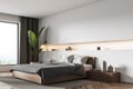 Panoramic bedroom with niche in white and indoor plant in the corner