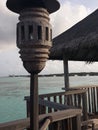 panoramic behind charming wooden railings along with a small hut above watervilla resort in gili lankanfushi maldives