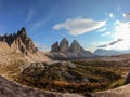 A panoramic capture of the famous Tre Cime di Lavaredo (Drei Zinnen) and surrounding mountains in Italian Dolomites. Royalty Free Stock Photo