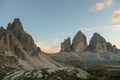 A panoramic capture of the sunset above Tre Cime di Lavaredo (Drei Zinnen) and surrounding mountains in Italian Dolomites. Royalty Free Stock Photo