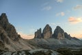 A panoramic capture of the sunset above Tre Cime di Lavaredo (Drei Zinnen) and surrounding mountains in Italian Dolomites. Royalty Free Stock Photo