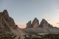 A panoramic capture of the sunset above Tre Cime di Lavaredo (Drei Zinnen) and surrounding mountains in Italian Dolomites. Royalty Free Stock Photo