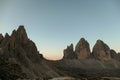 A panoramic capture of the sunset above Tre Cime di Lavaredo (Drei Zinnen) and surrounding mountains in Italian Dolomites. Royalty Free Stock Photo