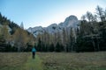 Hochschwab - A woman hiking through the forest in Alps