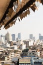 Panoramic city skyline of Bangkok with Buddhist wish bells on the foreground, Thailand