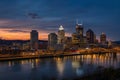 Panoramic city waterfront at dusk with warm glow Royalty Free Stock Photo