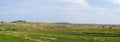 Panoramic clay road in the endless fields Royalty Free Stock Photo