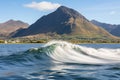 Panoramic coastal vista. gleaming sun, towering waves, anxious anticipation of the approaching swell