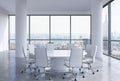 Panoramic conference room in modern office in New York City. White chairs and a white round table.