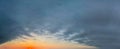 Panoramic dark clouds on bright golden sky background Royalty Free Stock Photo