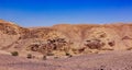 Panoramic desert landscape wasteland dry scenic environment sand stone ground and mountain rocks background of Negev Israeli Royalty Free Stock Photo