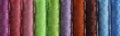 Detail view of differently colored spools of thread