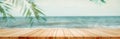 Panoramic empty clean wood counter table top blur shinny white bokeh light on summer beach background for product morning scene