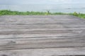 Panoramic empty clean wood counter table top blur shinny white bokeh light on summer beach background for product morning scene