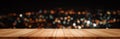 Panoramic empty clean wood counter table top on blur street night cafe background use for pub coffee shop montage dark scene, Royalty Free Stock Photo