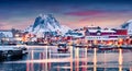 Panoramic evening view of Ballstad port. Astonishing winter sunset on Lofoten Islands, Norway