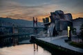 Panoramic exterior view of the Guggenheim museum in Bilbao at sunset Royalty Free Stock Photo