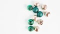 Panoramic festive christmas banner. christmas decor on a light background. balloons of gold and green in a festive composition.