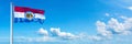 Missouri Flag - state of USA, flag waving on a blue sky in beautiful clouds - Horizontal banner