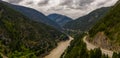 Panoramic format photo of the fresh spring green foliage in the Lillooet-Fraser Canyon, British Columbia, Canada