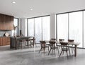 Panoramic gray kitchen corner with bar and table Royalty Free Stock Photo
