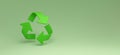 Panoramic Green recycling sign on green background for ecological waste management and a sustainable and economical lifestyle