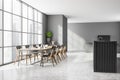 Panoramic grey kitchen and living room with table Royalty Free Stock Photo